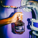 Person Holding A Bottle Of Burnt Faith Brandy