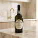 Bottle of Ferreira Porto wine on a marble countertop with a kitchen background