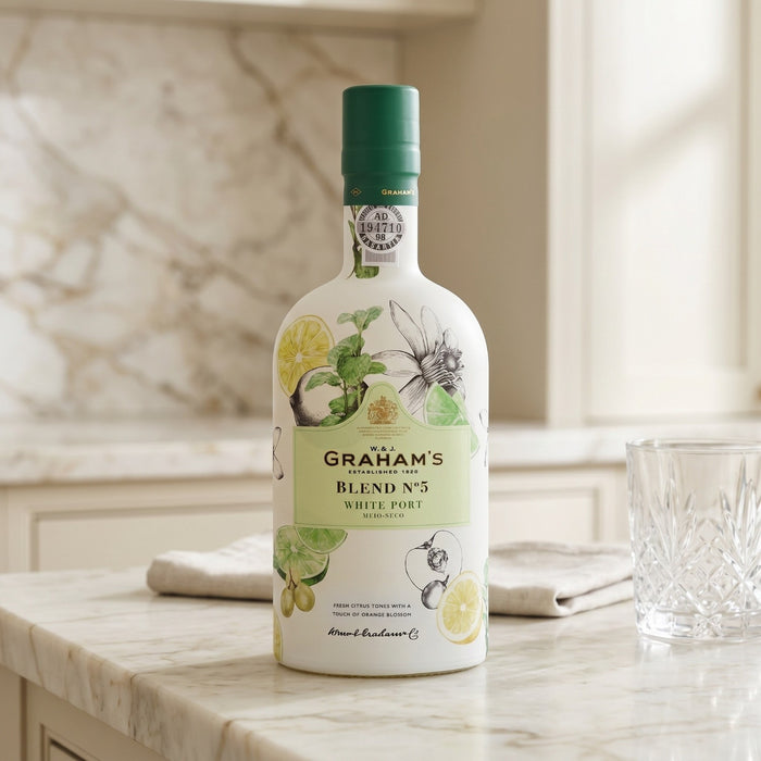 Grahams Blend No.5 Port on a marble countertop with a glass and cloth in the background