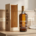 Kopke Porto bottle and wooden box on a wooden surface