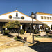 Sandeman winery building with barrels and outdoor seating area.
