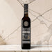 Sandeman Royal Ambrosante Pedro Ximenez 20 Year Old Sherry on a marble countertop.