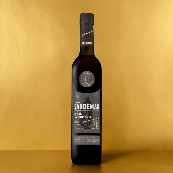 Sandeman Royal Ambrosante Pedro Ximenez 20 Year Old Sherry with a gold backdrop.
