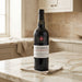 Bottle of Taylor's Port wine on a marble countertop in a kitchen.