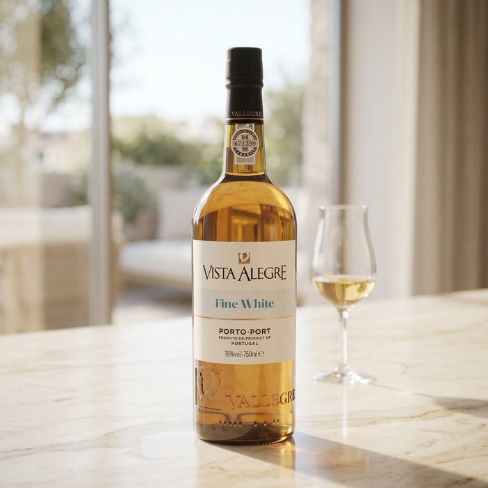 Vista Alegre Fine White wine bottle with a glass on a marble surface