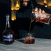 Pouring A Cocktail Made With Burnt Faith Brandy