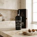 Kopke 50 year old tawny porto bottle and box on a marble surface