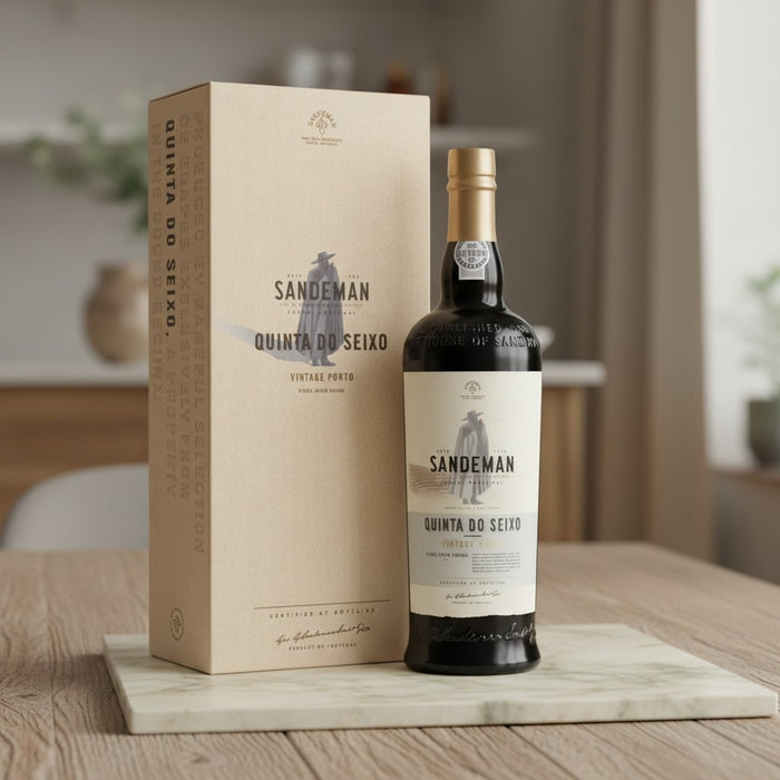 Sandeman Quinta do Seixo Port wine bottle and box on a wooden table