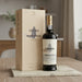 Sandeman Quinta do Seixo Port wine bottle and box on a wooden table